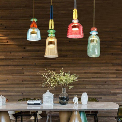 Coloured glass pendants against a timber wall