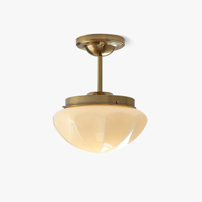 Gold compact semi-flush ceiling light with a faceted bowl shade