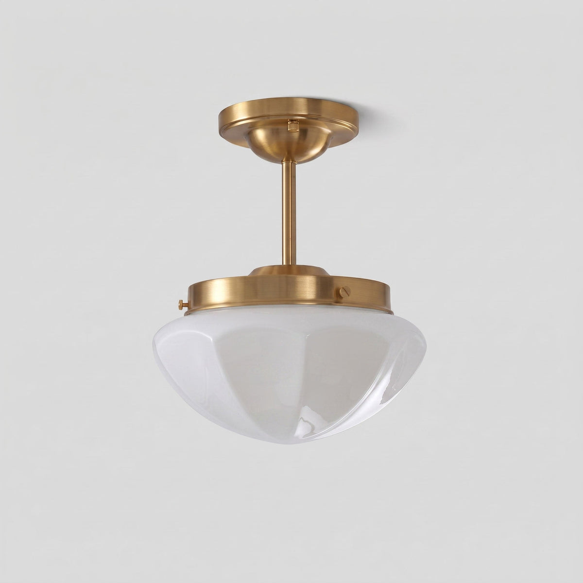 Gold long-stem ceiling light with a white faceted shade