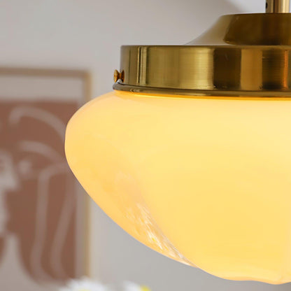 Close-up of a compact ceiling light metal housing and faceted shade