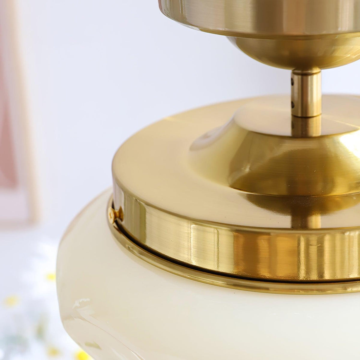 Close-up of a gold semi-flush ceiling light mounting