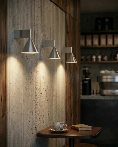 Cone wall lights above a table