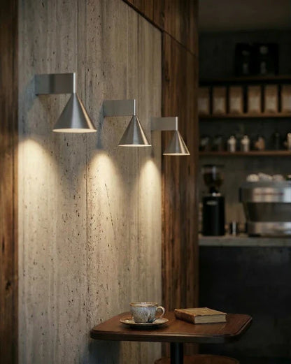 Cone wall lights above a table
