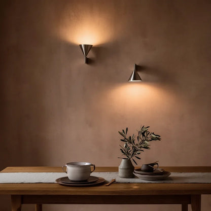 Cone sconces arranged for upward and downward light