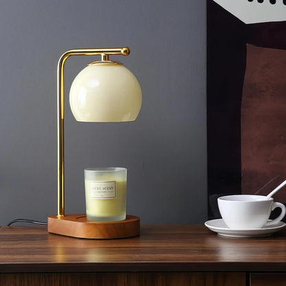 Cream glass candle warmer with a dark base