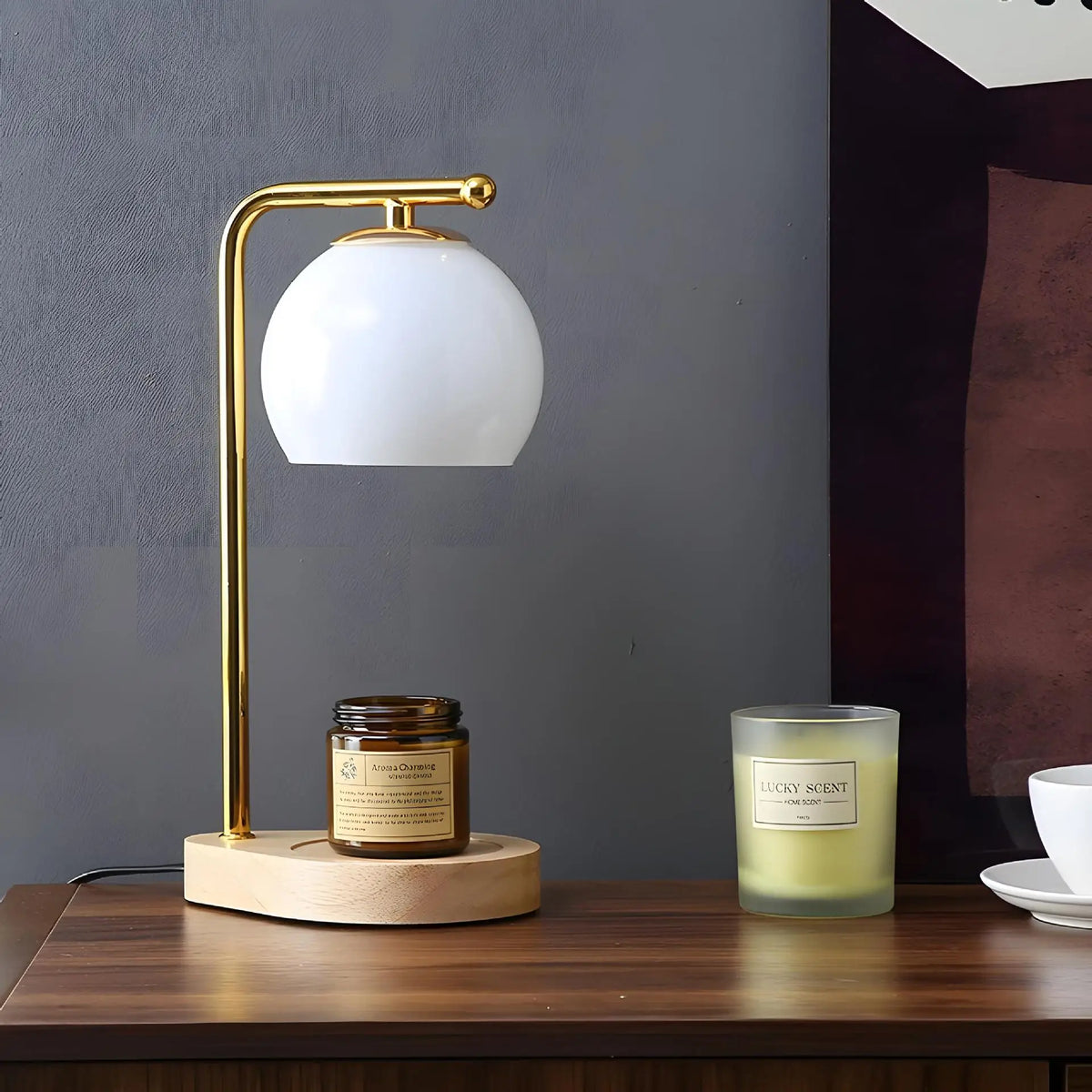 White glass globe candle warmer with a pale round base