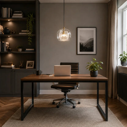 A 20cm clear ribbed glass globe pendant light hangs above a modern home office desk, providing cool illumination in a stylish, contemporary workspace.