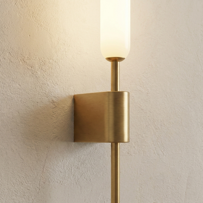 Close-up of double-head copper wall light with marble-effect shades