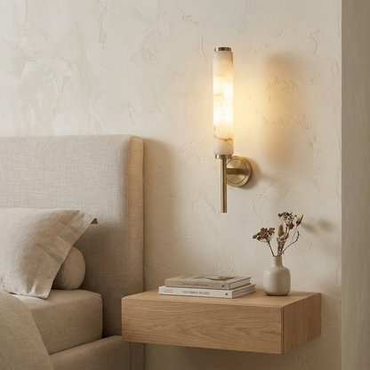 Single-head copper bedside wall light in an interior setting