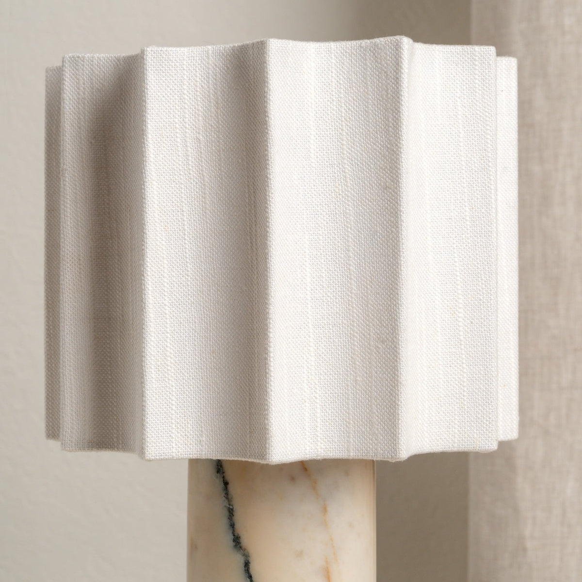 Close-up of the sculpted linen table lamp shade