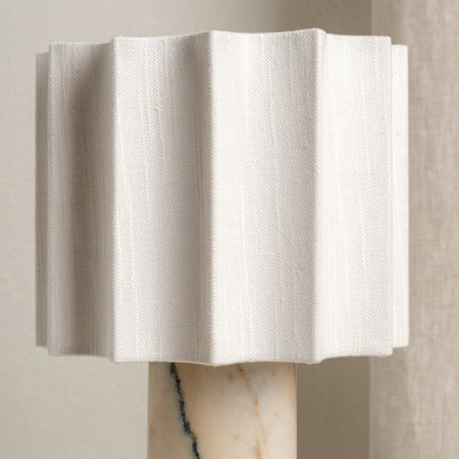 Close-up of the sculpted linen table lamp shade