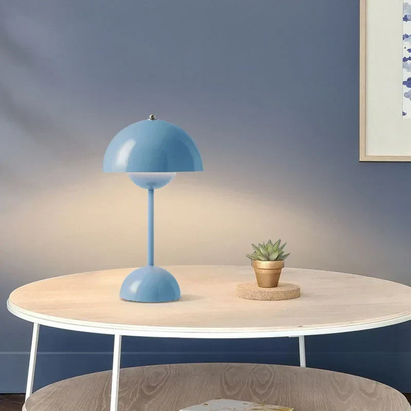 Blue dome lamp glowing on a small table