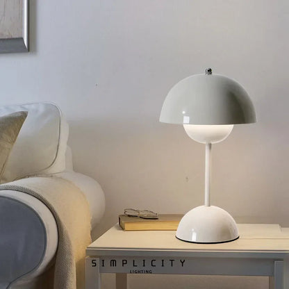 White dome table lamp on a bedside table