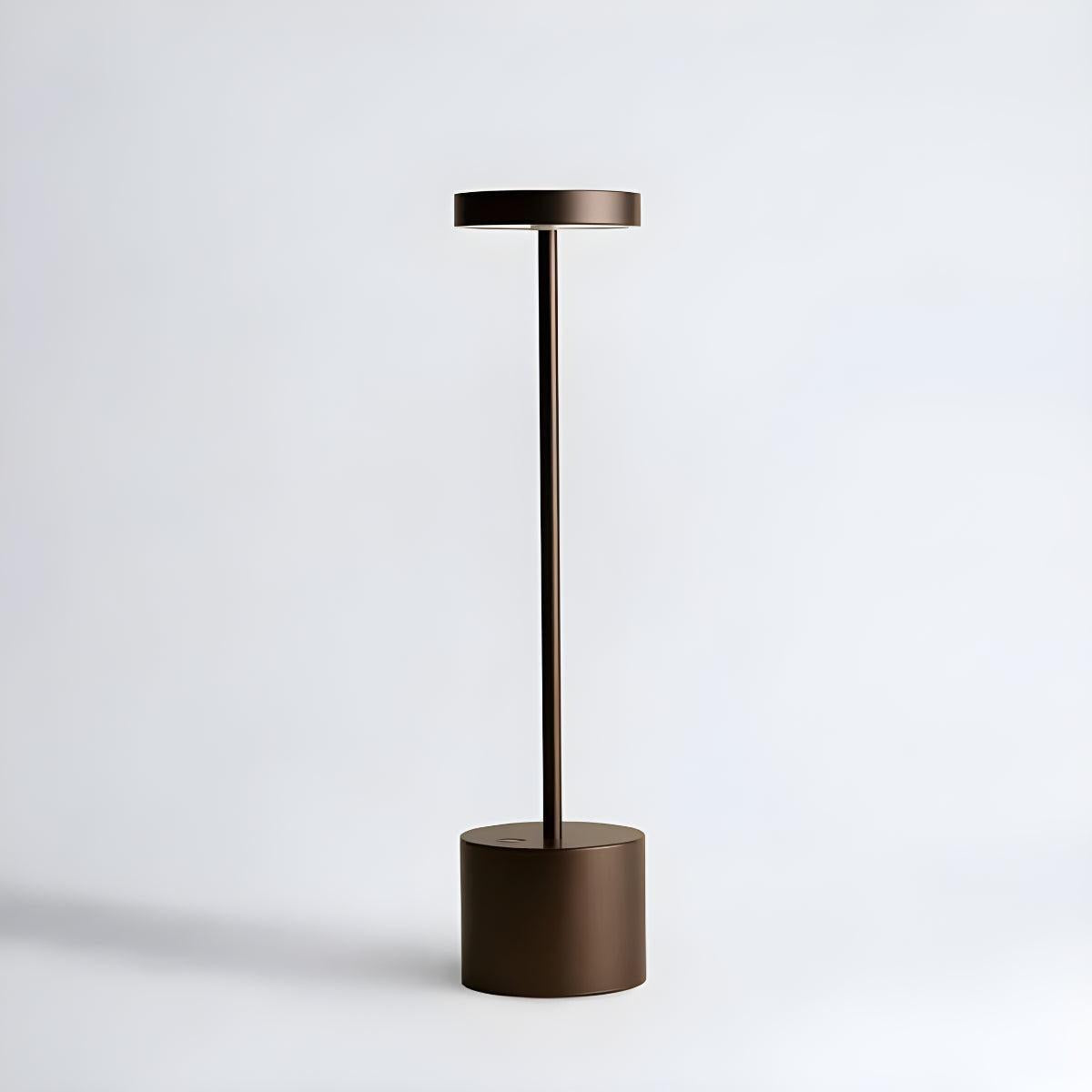 Brown cordless table lamp with a flat circular head