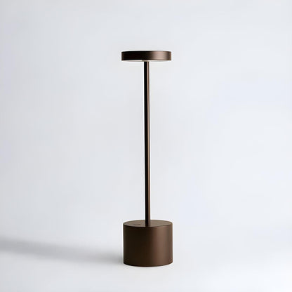 Brown cordless table lamp with a flat circular head