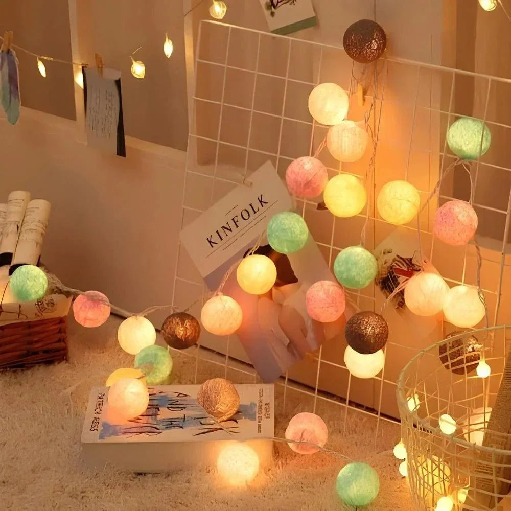Multicolour cotton ball lights decorating a wall grid