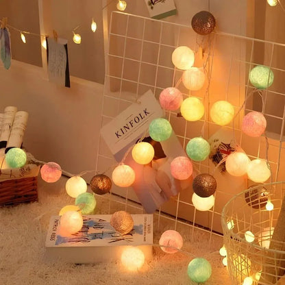 Multicolour cotton ball lights decorating a wall grid