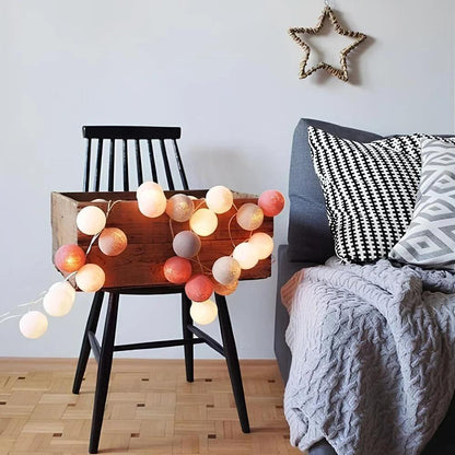 Red and white cotton ball garland draped over a chair