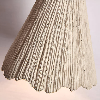 Close view of textured scalloped pendant edge