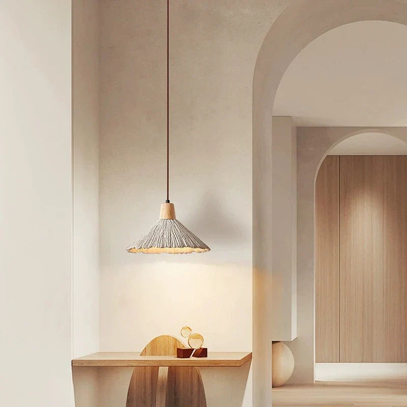 Cream wide pendant above a small table