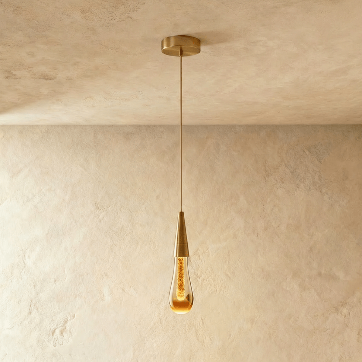 Single crystal teardrop pendant with gold-tone frame