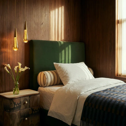 Crystal drop pendants beside a bed