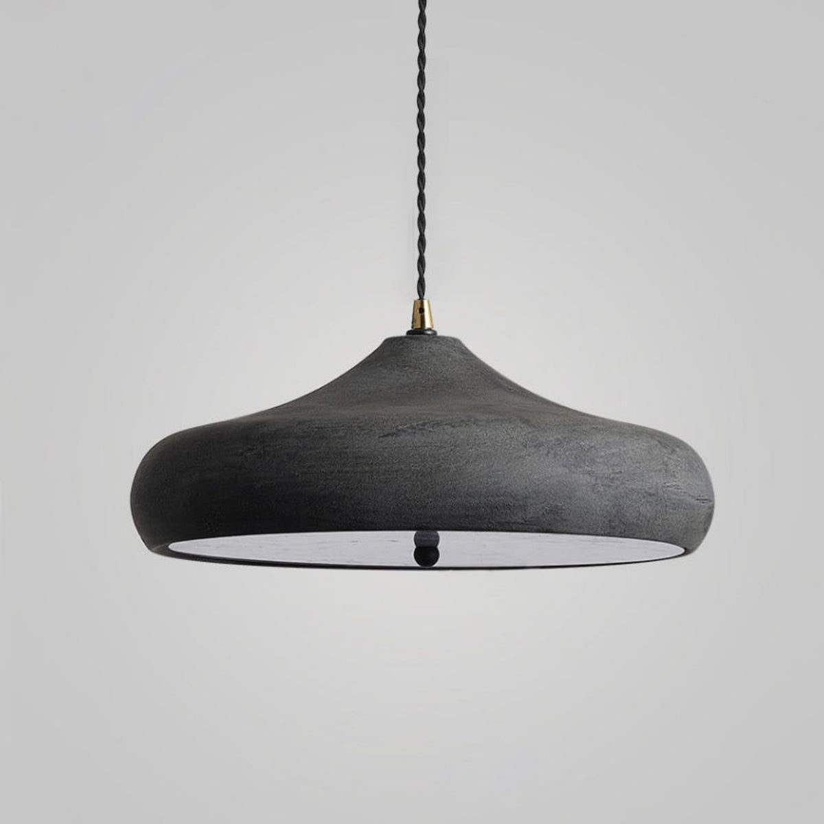 Close-up of a dark matte curved pendant shade
