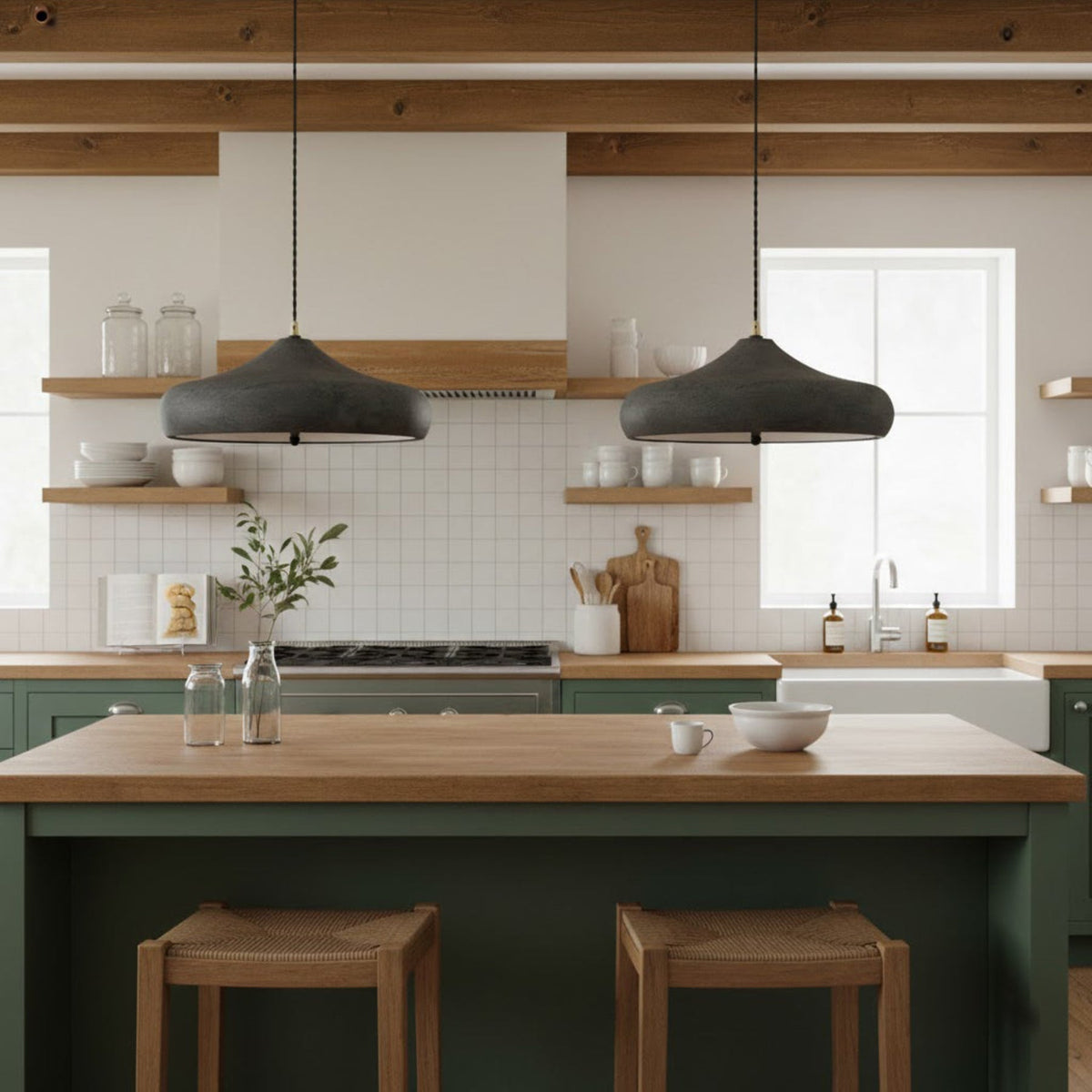 Two dark iron pendants above a kitchen island