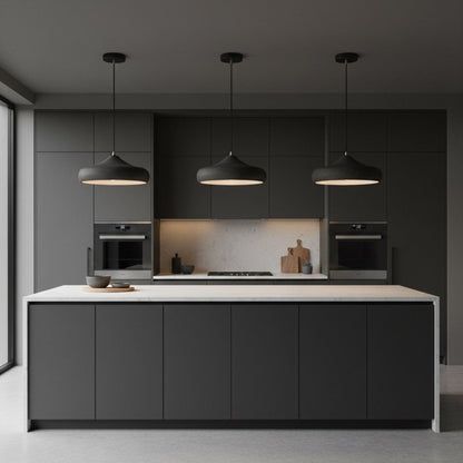 Three dark iron pendants above a kitchen island