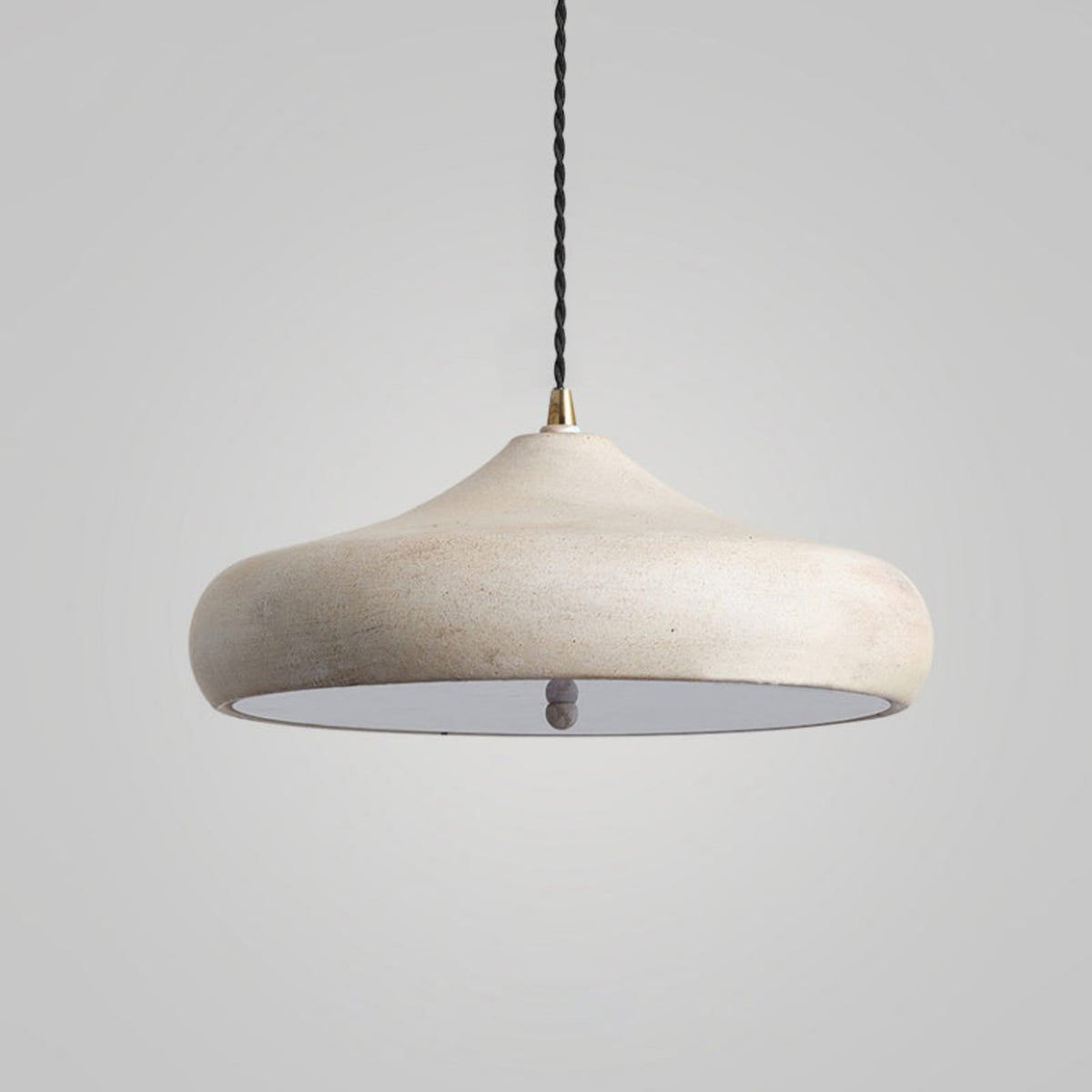 White curved iron pendant shade viewed close up