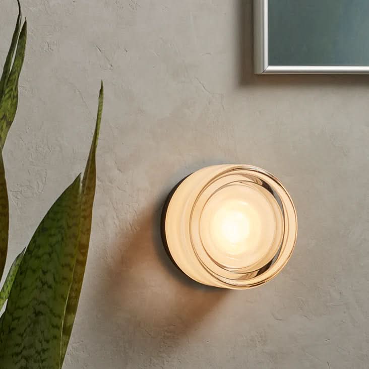 Glass wall sconce with soft LED illumination