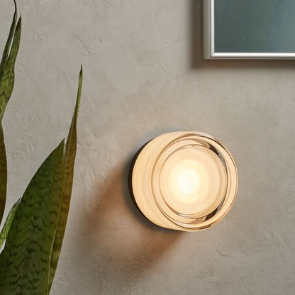 Glass wall sconce with soft LED illumination