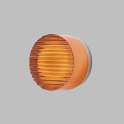 Modern glass wall sconce with integrated LED lighting