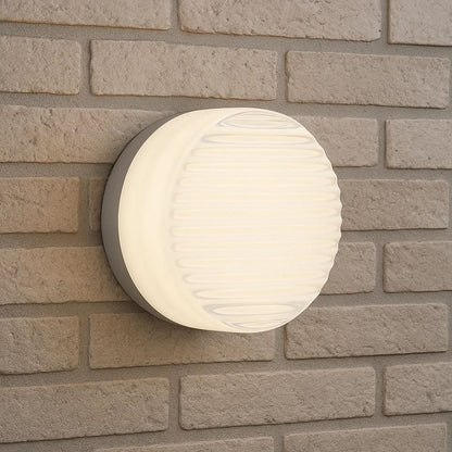 Dimmable LED wall light with rounded glass shade