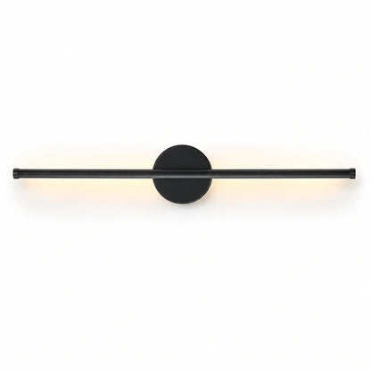 A modern, matte black linear LED wall light with a circular mounting base, emitting a soft, warm glow against a clean white background.