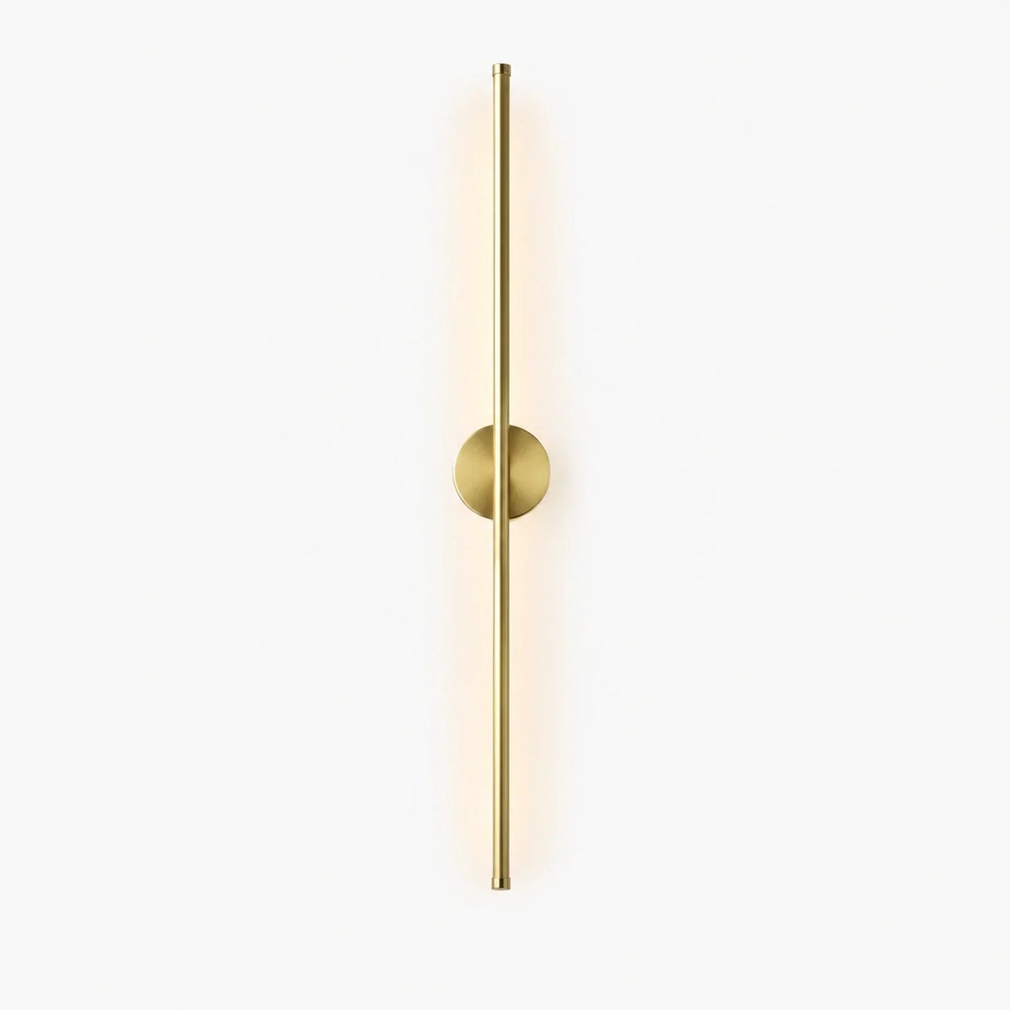 A sleek, vertical gold-toned LED wall light featuring a slim cylindrical bar mounted on a circular base, providing soft, modern illumination for interiors.