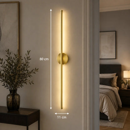 80cm gold dimmable LED wall light mounted vertically in a bedroom, featuring a slim modern design with touch control and warm ambient illumination.