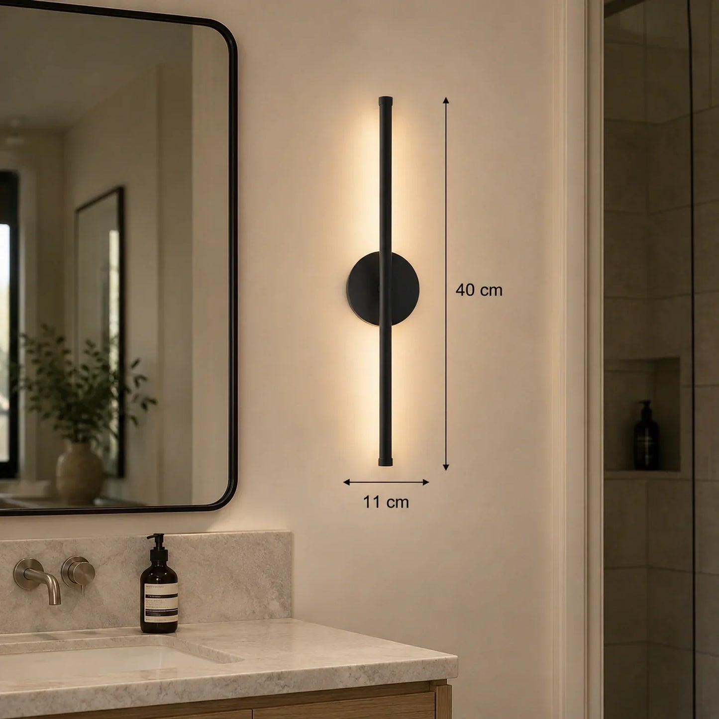 40cm black dimmable LED wall light mounted in a modern bathroom, showing dimensions of 40cm height and 11cm width with warm ambient illumination.