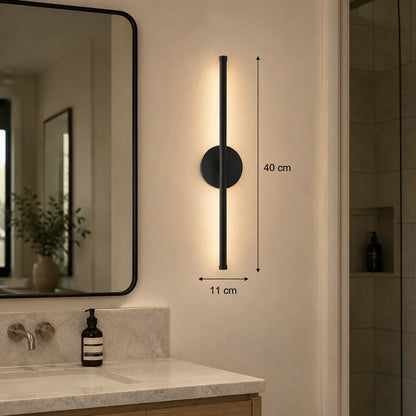 40cm black dimmable LED wall light mounted in a modern bathroom, showing dimensions of 40cm height and 11cm width with warm ambient illumination.