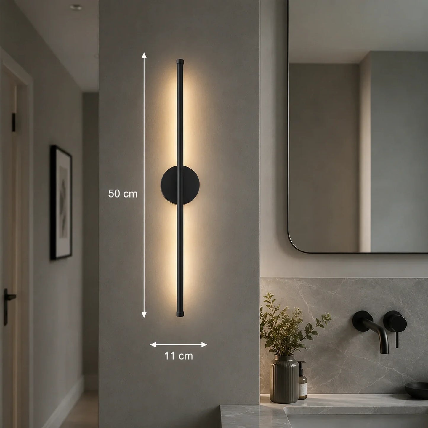 A 50cm black dimmable LED wall light mounted vertically in a modern bathroom, featuring a sleek linear design with warm illumination and touch control.