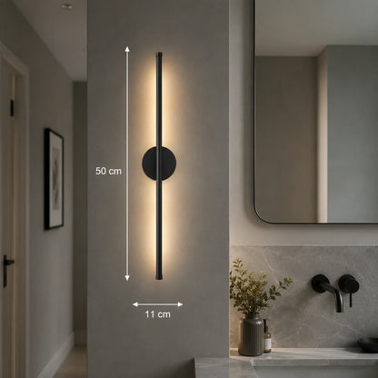 A 50cm black dimmable LED wall light mounted vertically in a modern bathroom, featuring a sleek linear design with warm illumination and touch control.