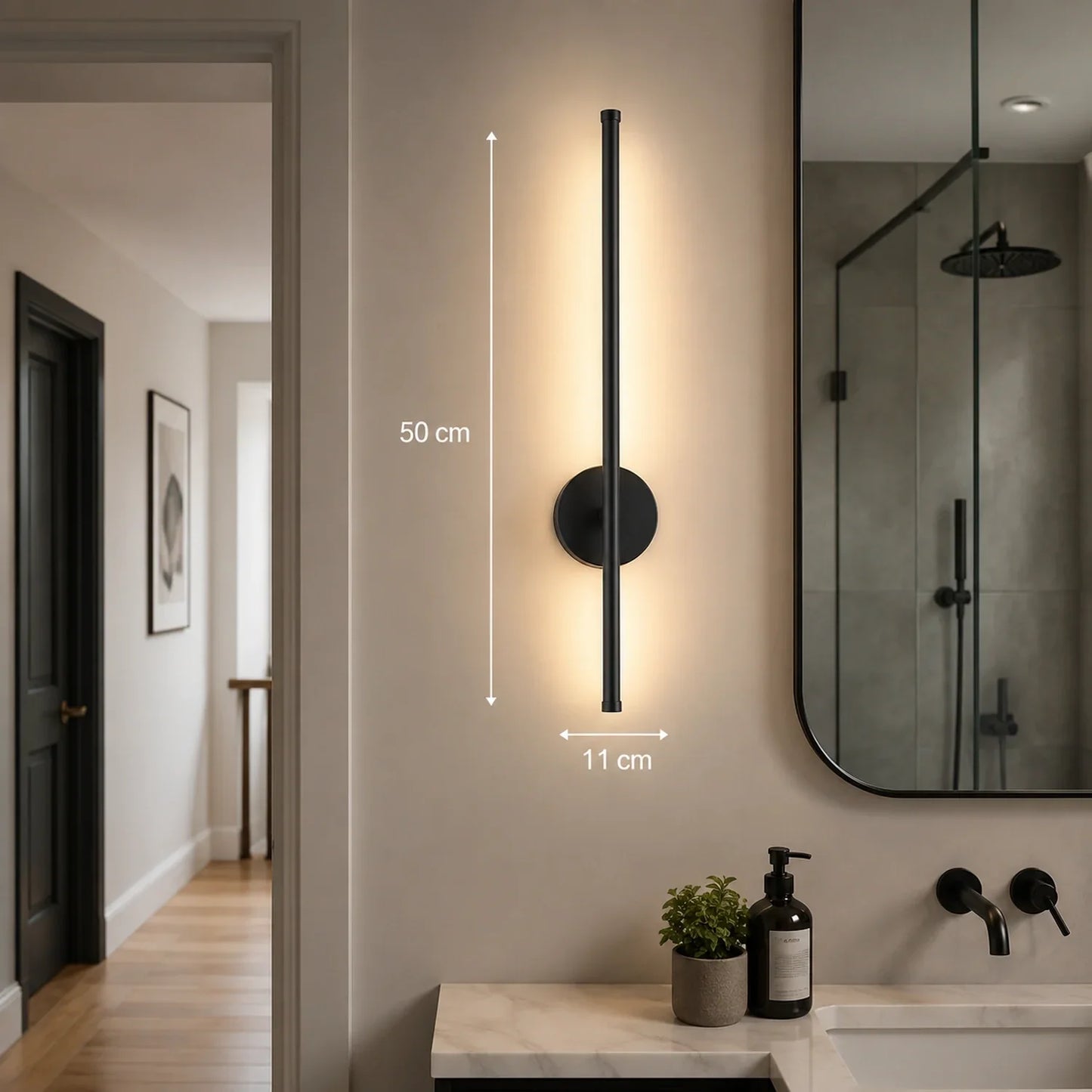 50cm black dimmable LED wall light mounted in a modern bathroom, featuring a sleek vertical design with warm illumination and touch control functionality.