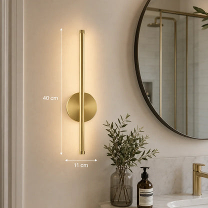Modern 40cm gold LED wall light mounted in a bathroom, featuring a sleek vertical design with warm illumination and clear dimension measurements.