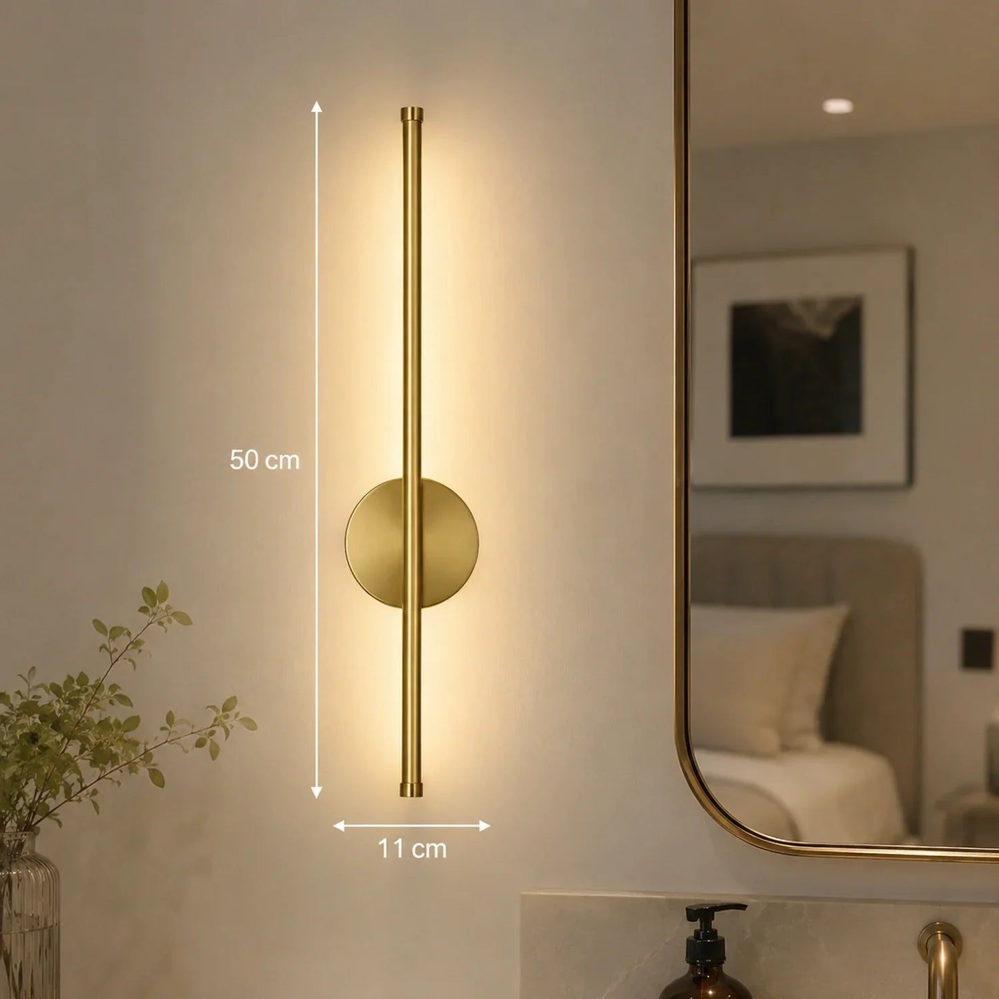 50cm gold dimmable LED wall light featuring a modern vertical design with touch control, mounted on a bedroom wall beside a mirror for ambient lighting.