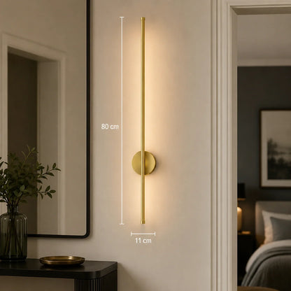 Modern 80cm gold dimmable LED wall light mounted in a hallway, featuring a sleek vertical design with warm illumination and touch control functionality.