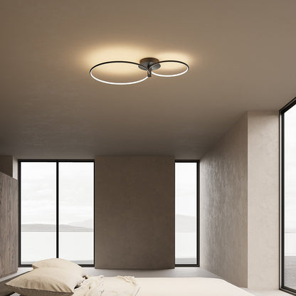 Black dimmable twin-ring LED ceiling light in a bedroom