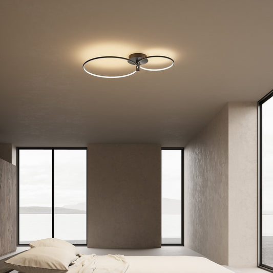 Black dimmable twin-ring LED ceiling light in a bedroom