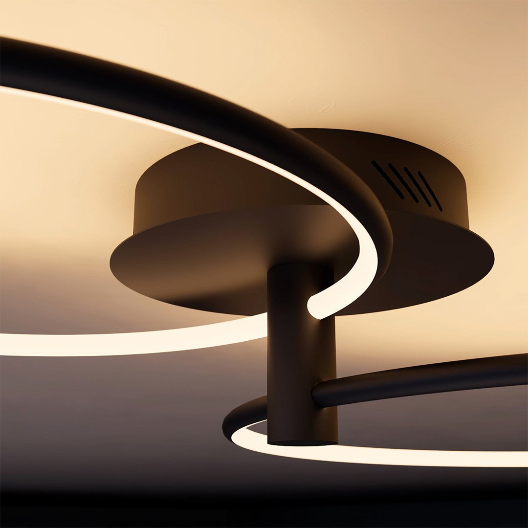 Close-up of a black twin-ring ceiling light canopy and LED ring