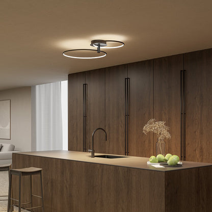 Black twin-ring LED ceiling light in a kitchen