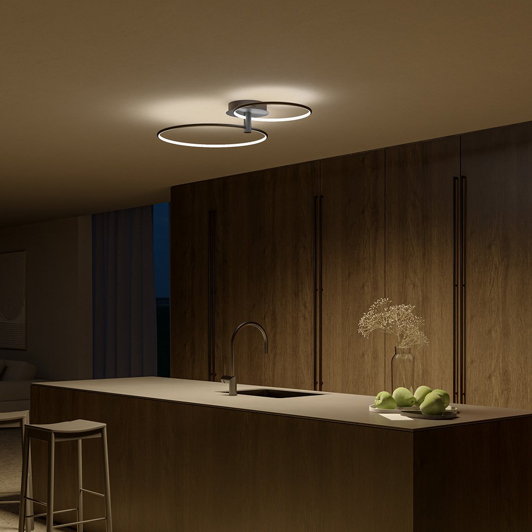 Black twin-ring LED ceiling light above a kitchen island